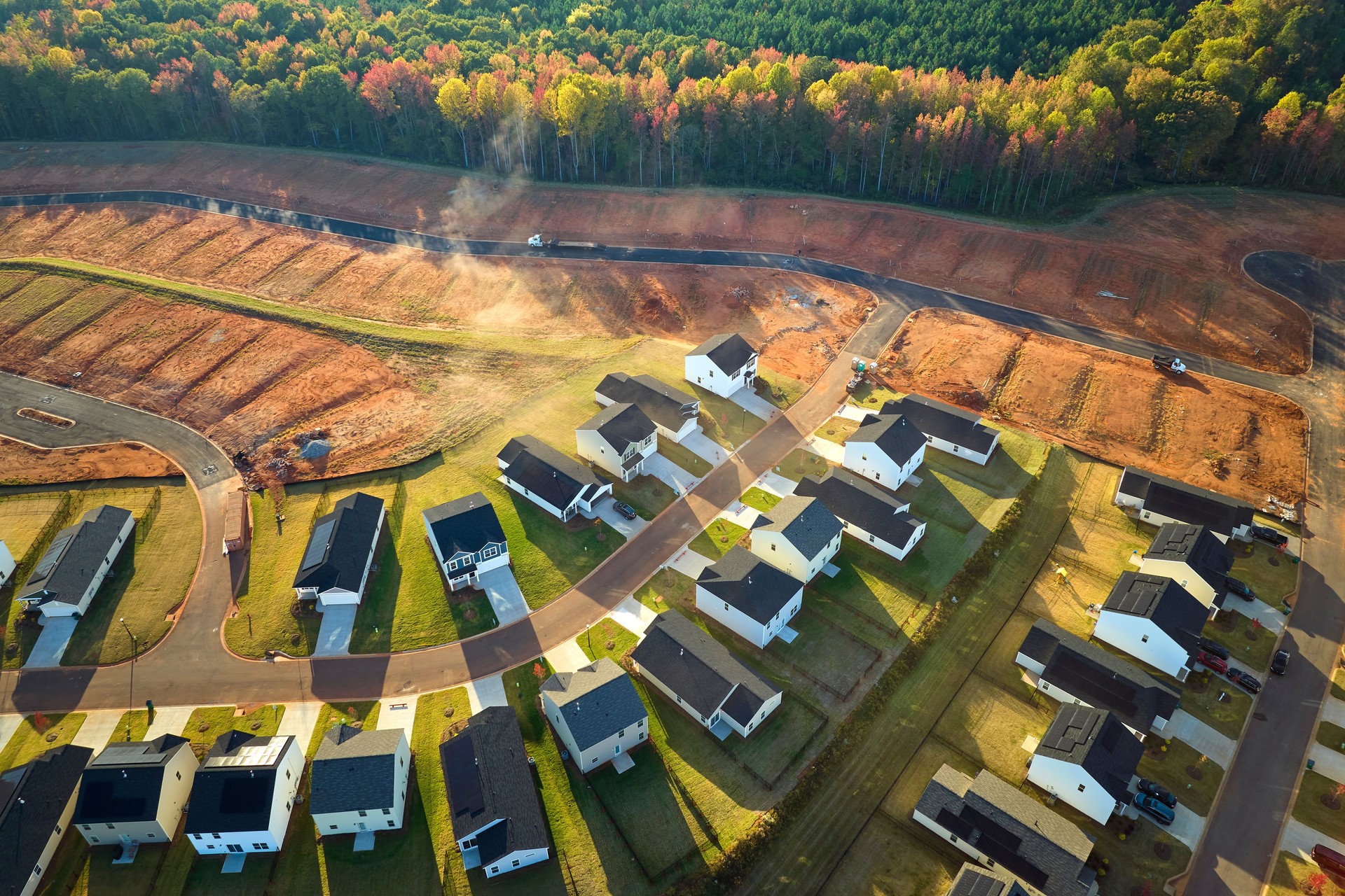 Aerial view of real estate development with tightly located family houses under construction in Carolinas suburban area. Concept of growing american suburbs